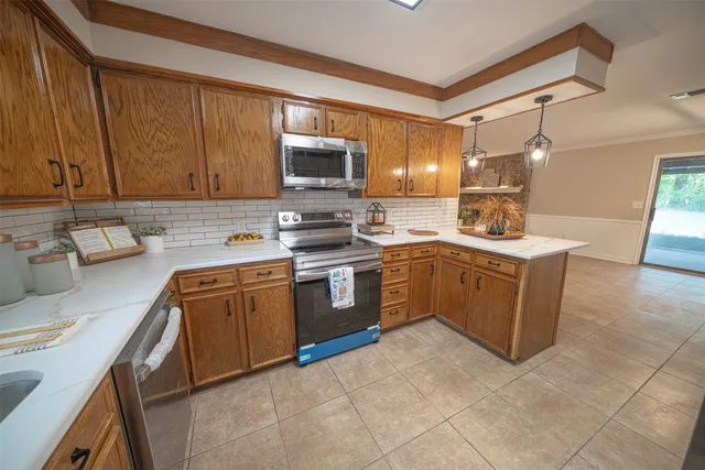 a view of empty room with a fireplace and fan