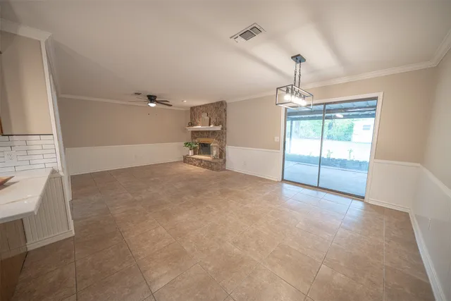 a white building with a potted plant