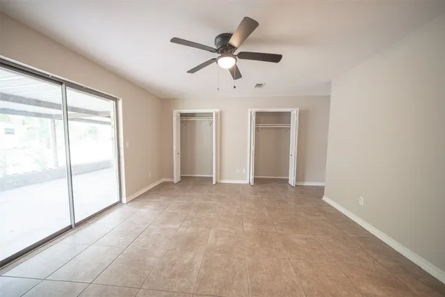 a bathroom with a double vanity sink toilet and a mirror