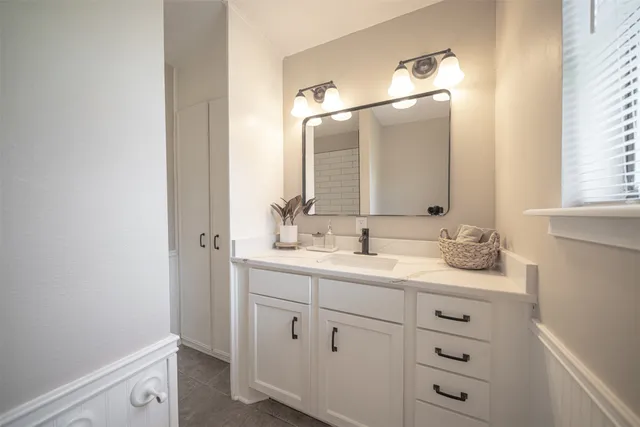 a view closed with granite countertop a sink and a window