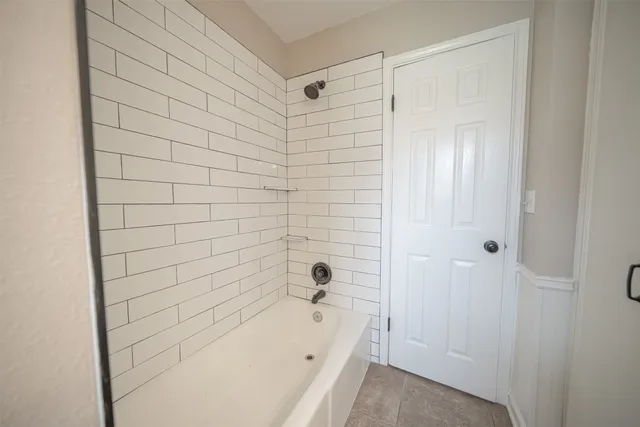 a kitchen with stainless steel appliances a stove a sink and a microwave