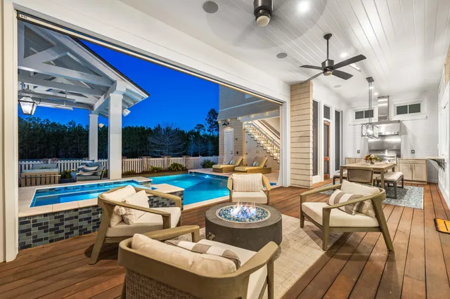 a living room with furniture fireplace and a flat screen tv