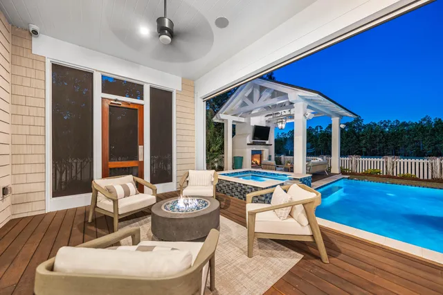 a living room with fireplace furniture and a flat screen tv