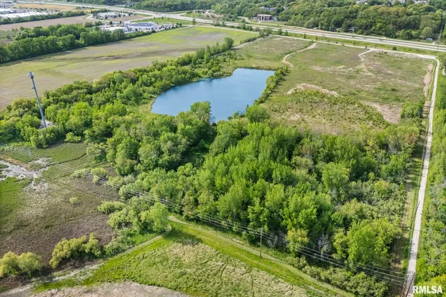 a view of a lake with a yard