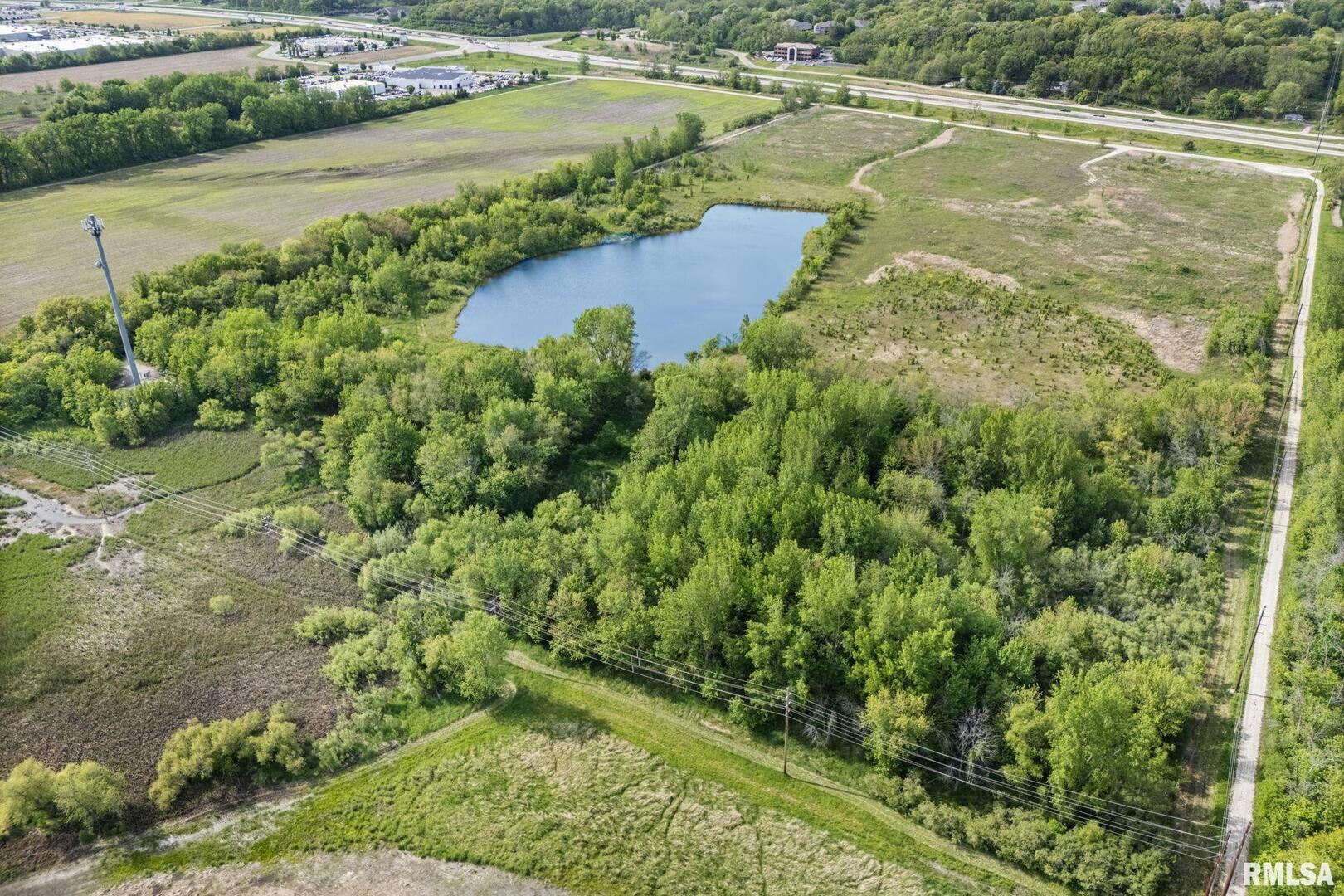 7300 John Deere Road Moline, IL 61265 - Photo 1 of 10 a view of a lake with a yard
