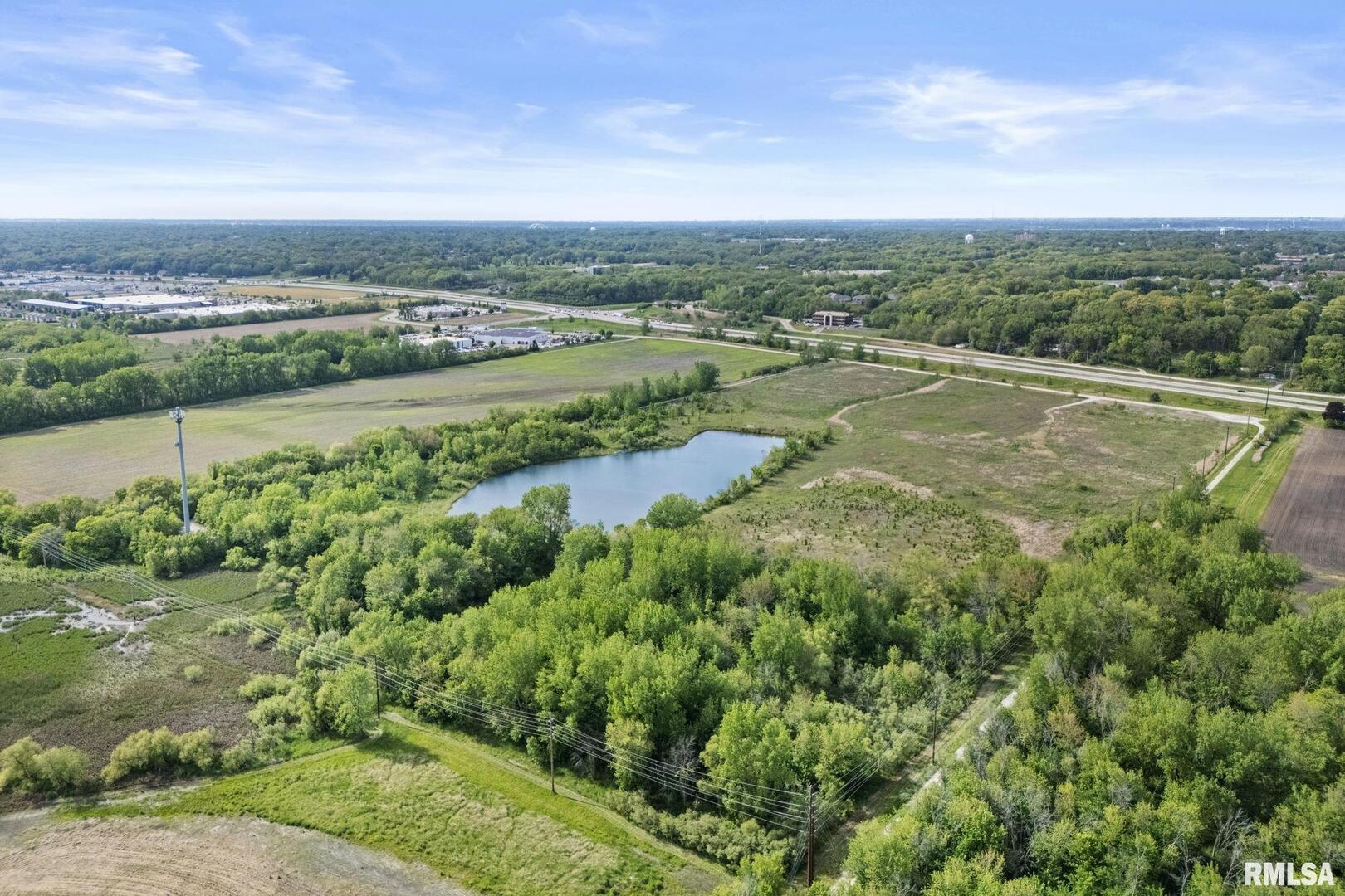 7300 John Deere Road Moline, IL 61265 - Photo 7 of 10 a view of a lake with a city