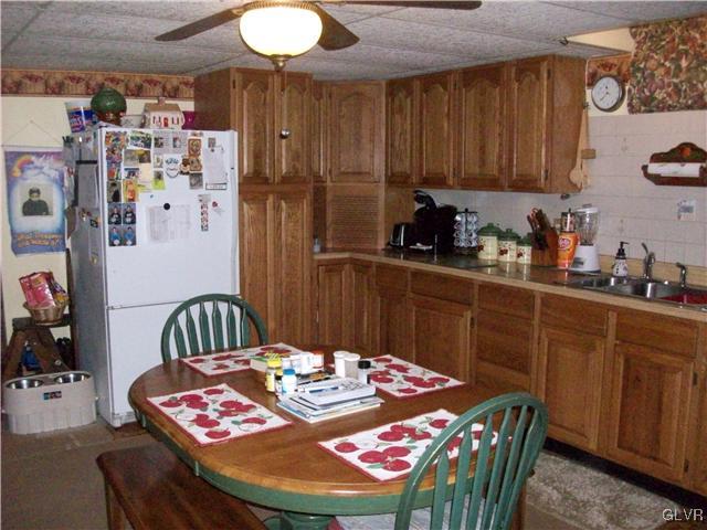 547 Turkey Ridge Road Mount Bethel, PA 18343 - Photo 11 of 14 a table and chairs in a kitchen