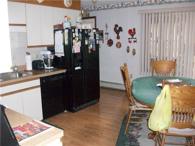 547 Turkey Ridge Road Mount Bethel, PA 18343 - Photo 6 of 14 a view of a kitchen area with furniture and wooden floor