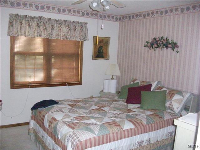 547 Turkey Ridge Road Mount Bethel, PA 18343 - Photo 10 of 14 a bedroom with a bed and a window