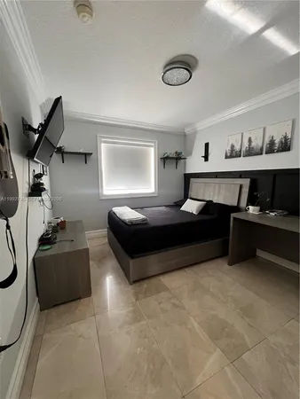 a bedroom with a bed and dresser