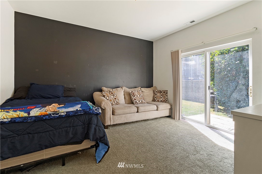 26410 218th Avenue Southeast Maple Valley, WA 98038 - Photo 15 of 28 a bedroom with a bed and large window