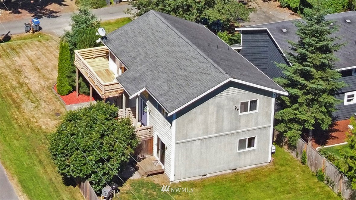 26410 218th Avenue Southeast Maple Valley, WA 98038 - Photo 22 of 28 aerial view of a house with a yard and plants