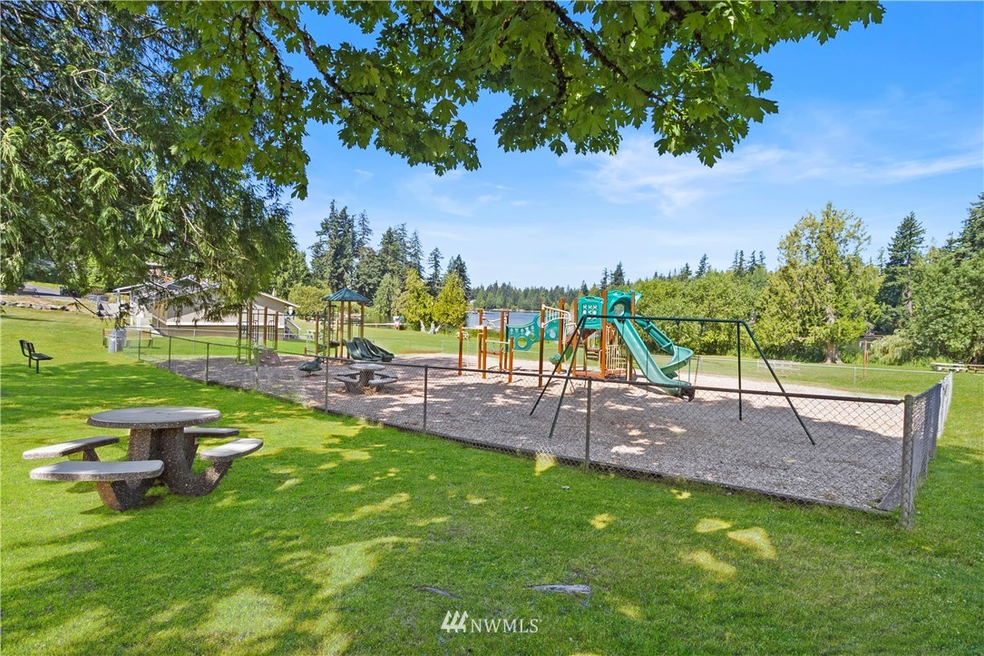 26410 218th Avenue Southeast Maple Valley, WA 98038 - Photo 26 of 28 a view of a backyard with sitting area