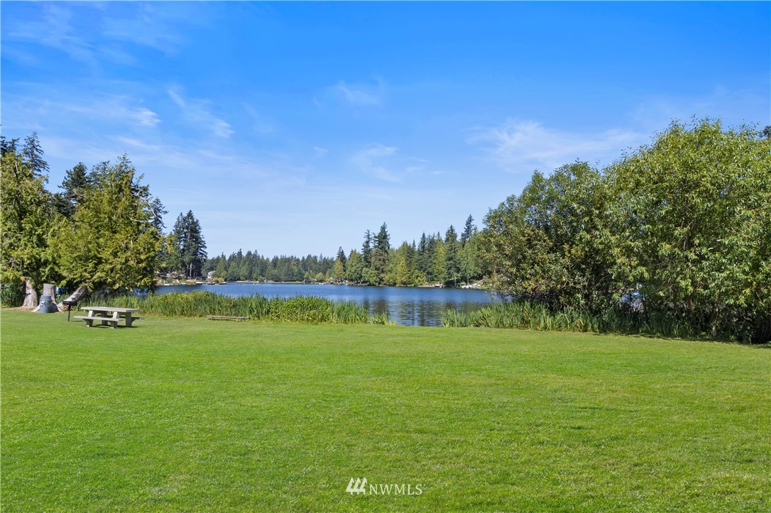 26410 218th Avenue Southeast Maple Valley, WA 98038 - Photo 27 of 28 a view of a lake with a big yard