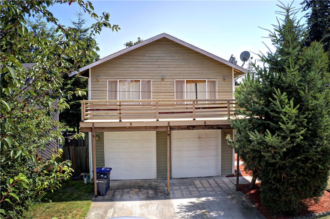 26410 218th Avenue Southeast Maple Valley, WA 98038 - Photo 28 of 28 a front view of a house with garden
