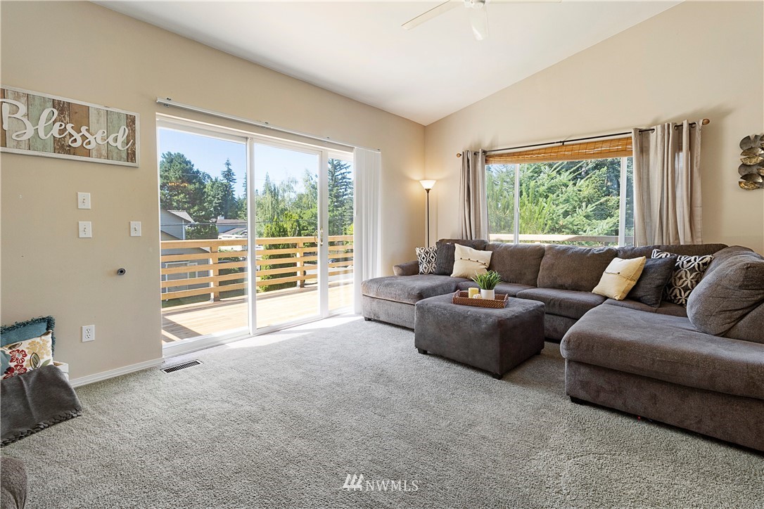 26410 218th Avenue Southeast Maple Valley, WA 98038 - Photo 6 of 28 a living room with furniture and a large window