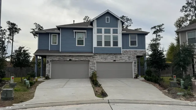a front view of a house with garage
