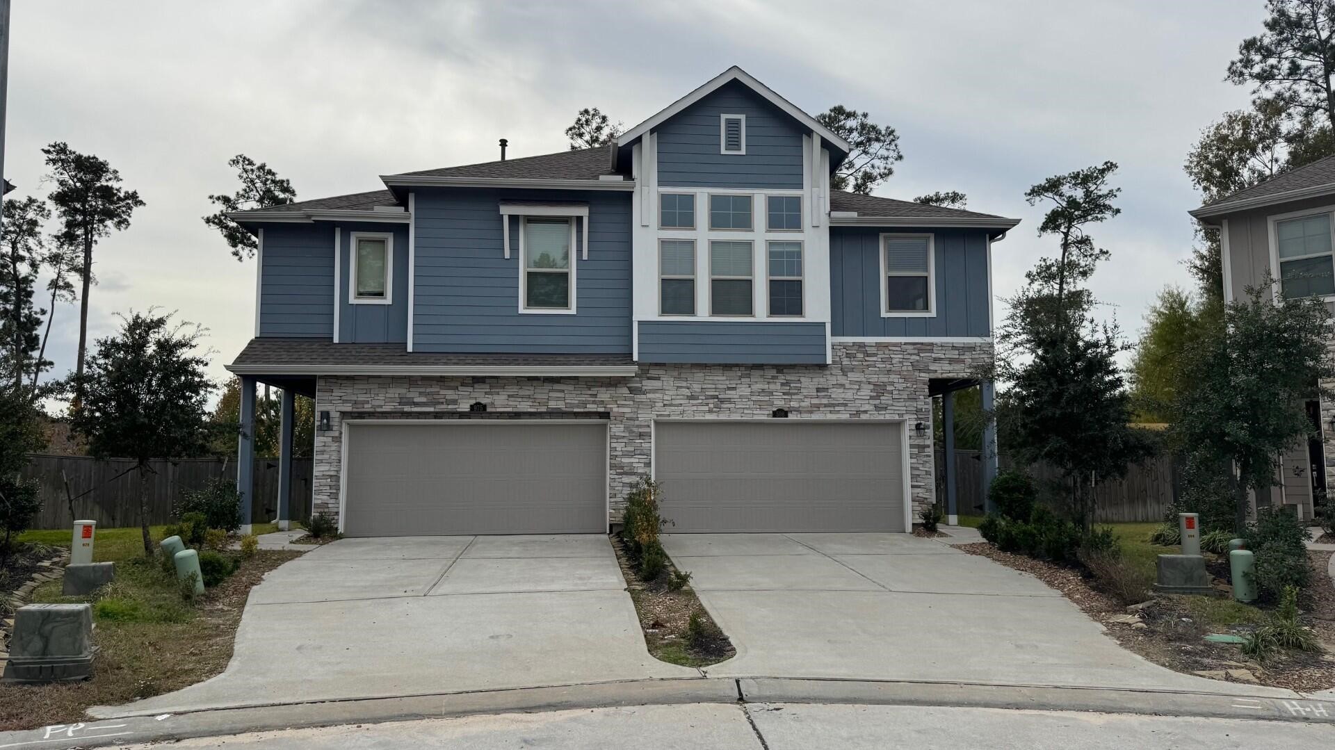 a front view of a house with garage