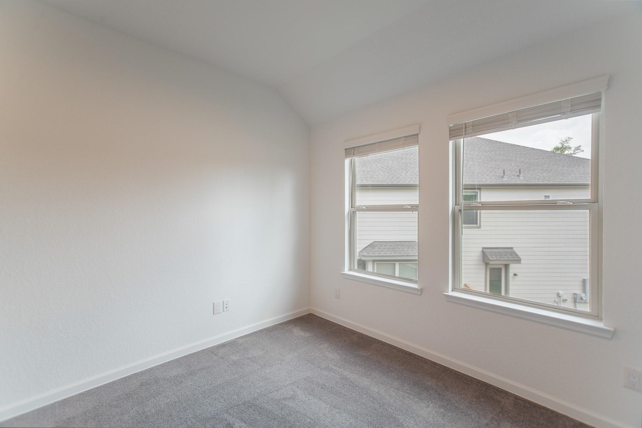 975 Lars Trek Trail Conroe, TX 77304 - Photo 11 of 36 an empty room with windows and closet