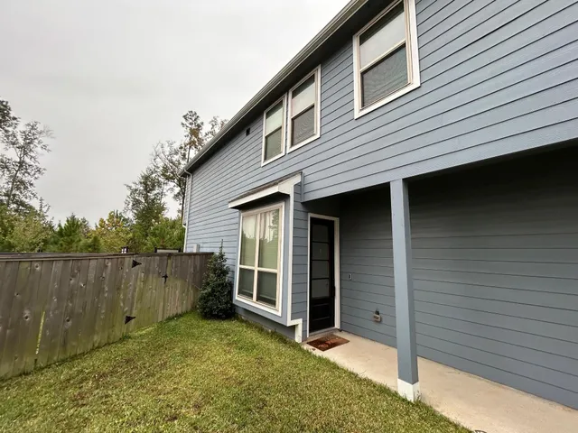a bathroom with a tub sink toilet and mirror