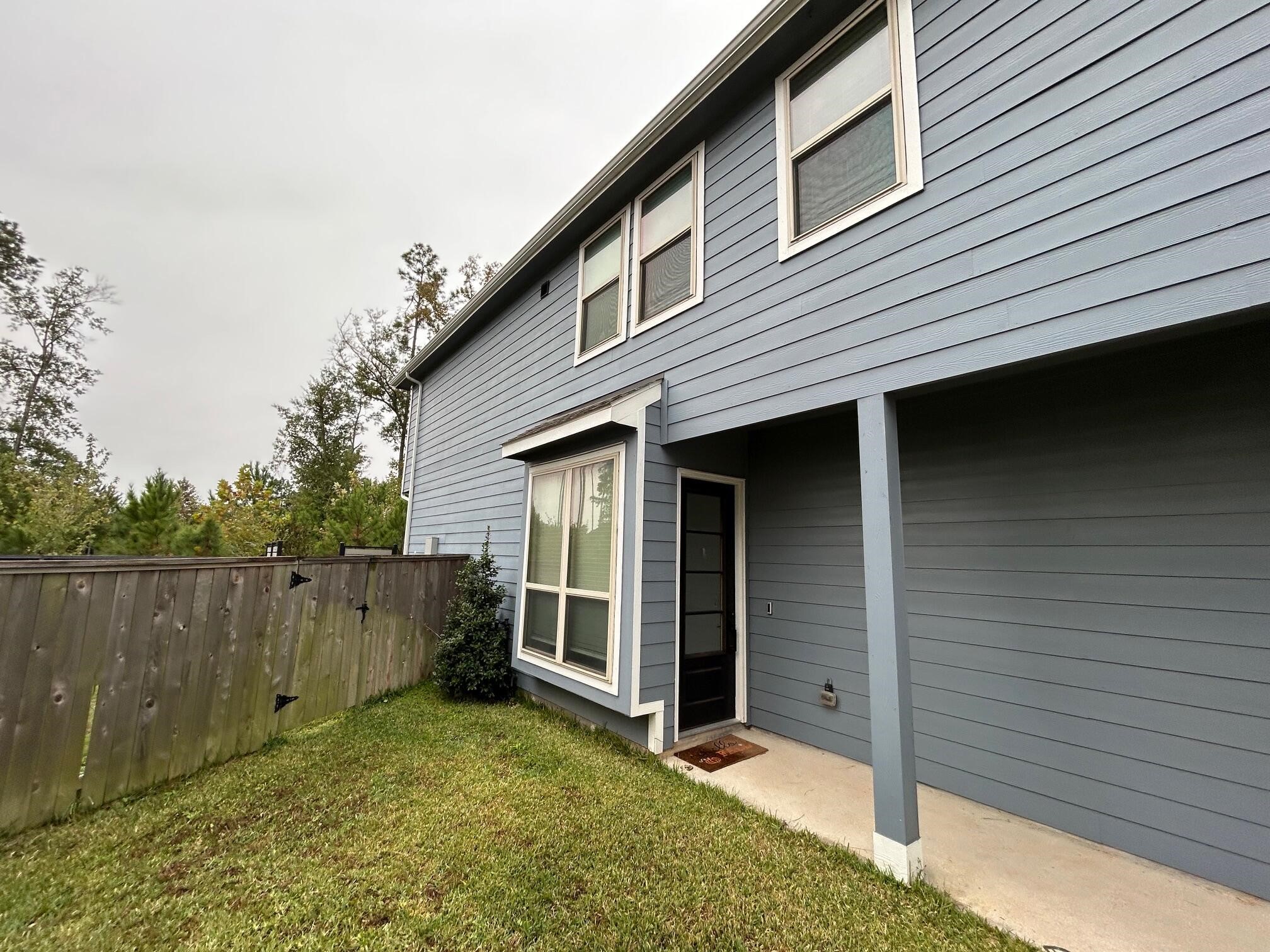 975 Lars Trek Trail Conroe, TX 77304 - Photo 15 of 36 a view of backyard of house