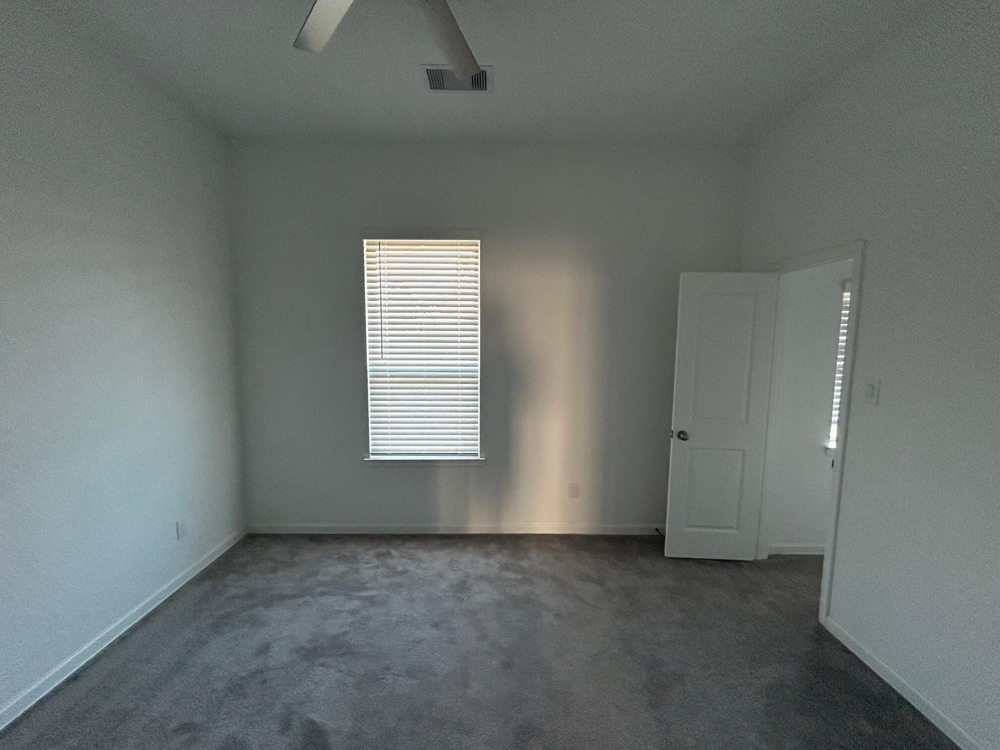 975 Lars Trek Trail Conroe, TX 77304 - Photo 18 of 36 an empty room with a empty space and windows