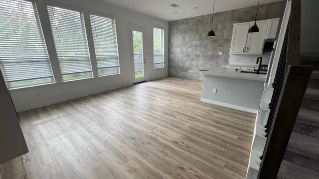 a white toilet sitting next to a sink