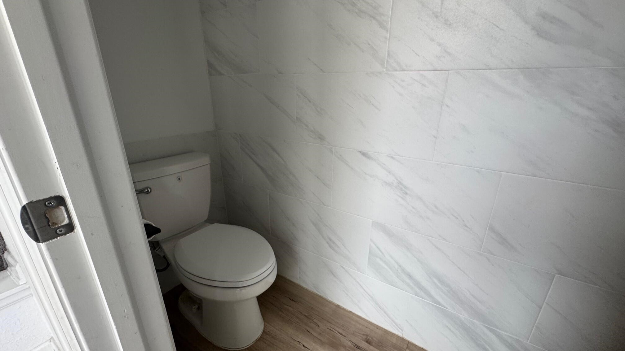 975 Lars Trek Trail Conroe, TX 77304 - Photo 23 of 36 a white toilet sitting next to a sink