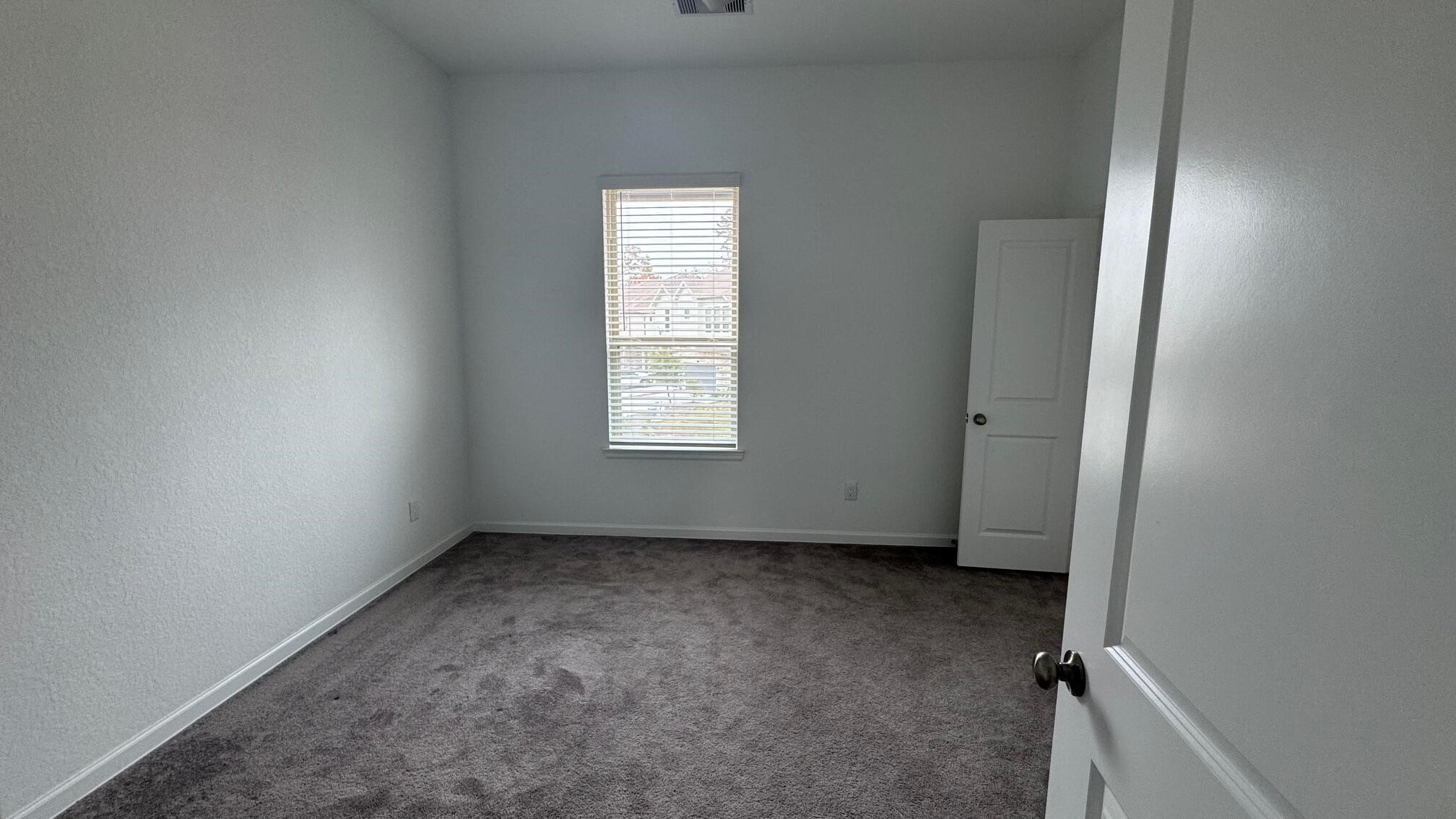 975 Lars Trek Trail Conroe, TX 77304 - Photo 36 of 36 an empty room with windows