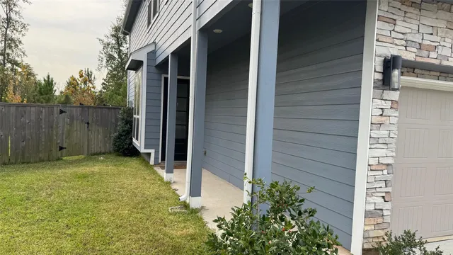 a open kitchen with stainless steel appliances granite countertop a stove top oven a sink dishwasher and a refrigerator with wooden floor