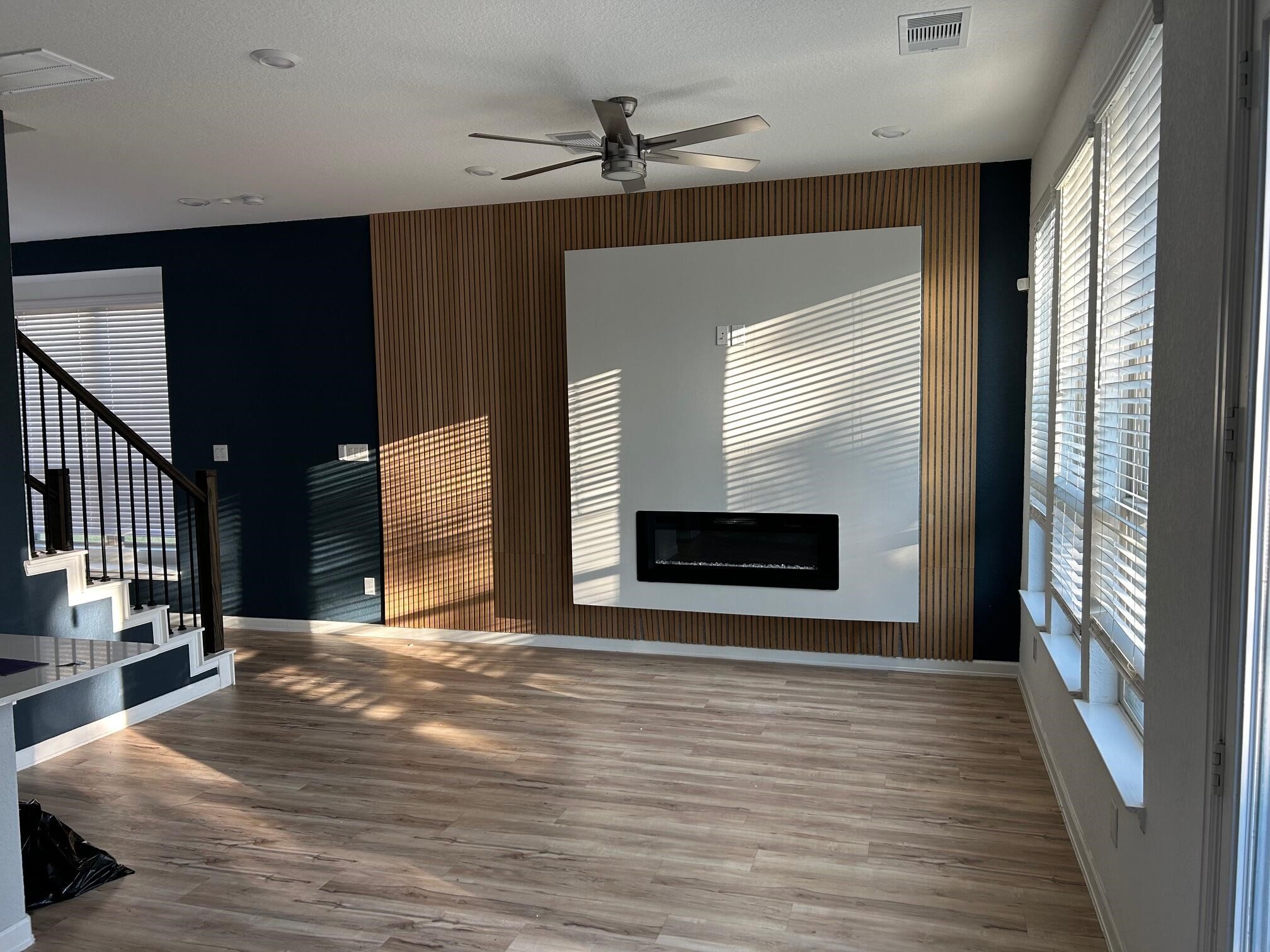 975 Lars Trek Trail Conroe, TX 77304 - Photo 7 of 36 a view of a hallway with wooden floor and a fireplace