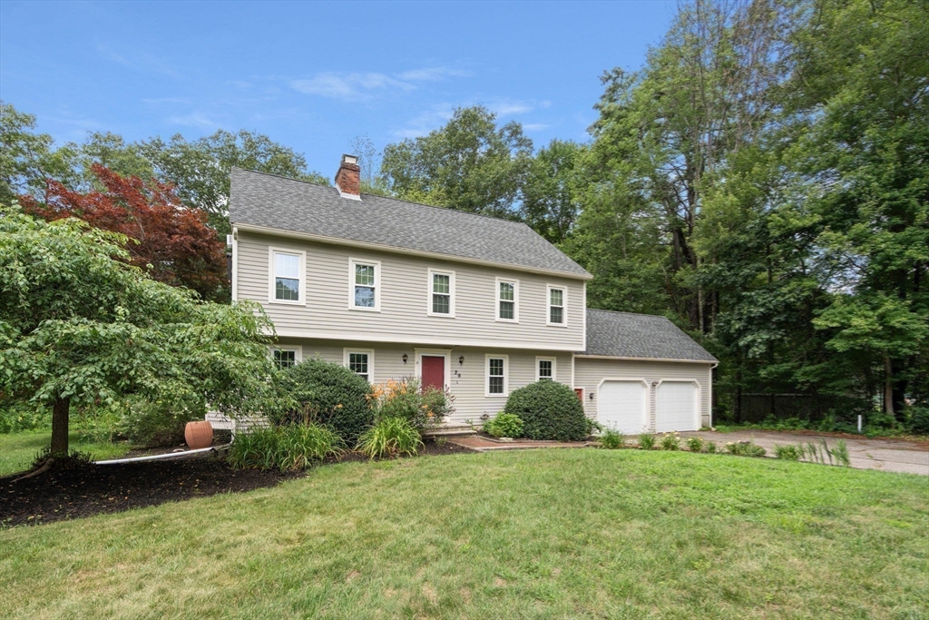 29 Chipper Hill Road Northbridge, MA 01534 - Photo 2 of 36 a front view of a house with a yard and trees