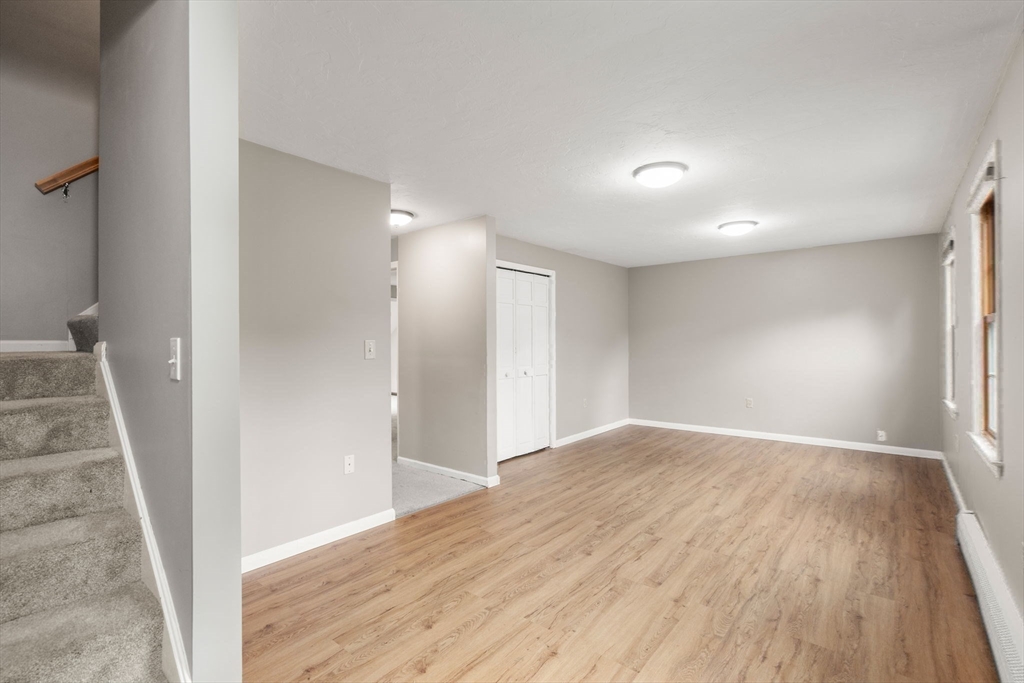 29 Chipper Hill Road Northbridge, MA 01534 - Photo 23 of 36 wooden floor in an empty room with a window