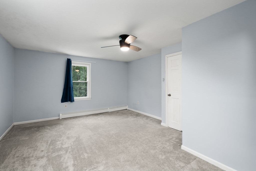 29 Chipper Hill Road Northbridge, MA 01534 - Photo 26 of 36 an empty room with ceiling fan and window