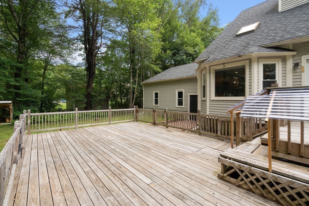 29 Chipper Hill Road Northbridge, MA 01534 - Photo 31 of 36 a view of backyard with deck and wooden floor