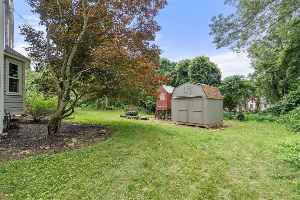 29 Chipper Hill Road Northbridge, MA 01534 - Photo 34 of 36 a view of a house with backyard and a tree