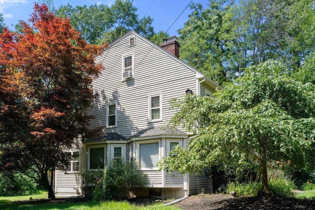 29 Chipper Hill Road Northbridge, MA 01534 - Photo 35 of 36 a view of house with a yard and potted plants