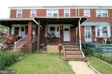 2018 Jasmine Road Baltimore, MD 21222 - Photo 1 of 6 a front view of a house with a porch
