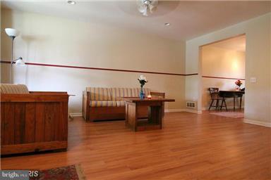 2018 Jasmine Road Baltimore, MD 21222 - Photo 2 of 6 a view of a living room filled with furniture and a kitchen view