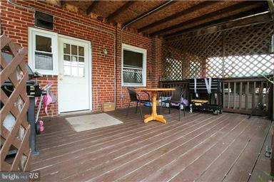 2018 Jasmine Road Baltimore, MD 21222 - Photo 6 of 6 a view of a house with wooden deck and furniture
