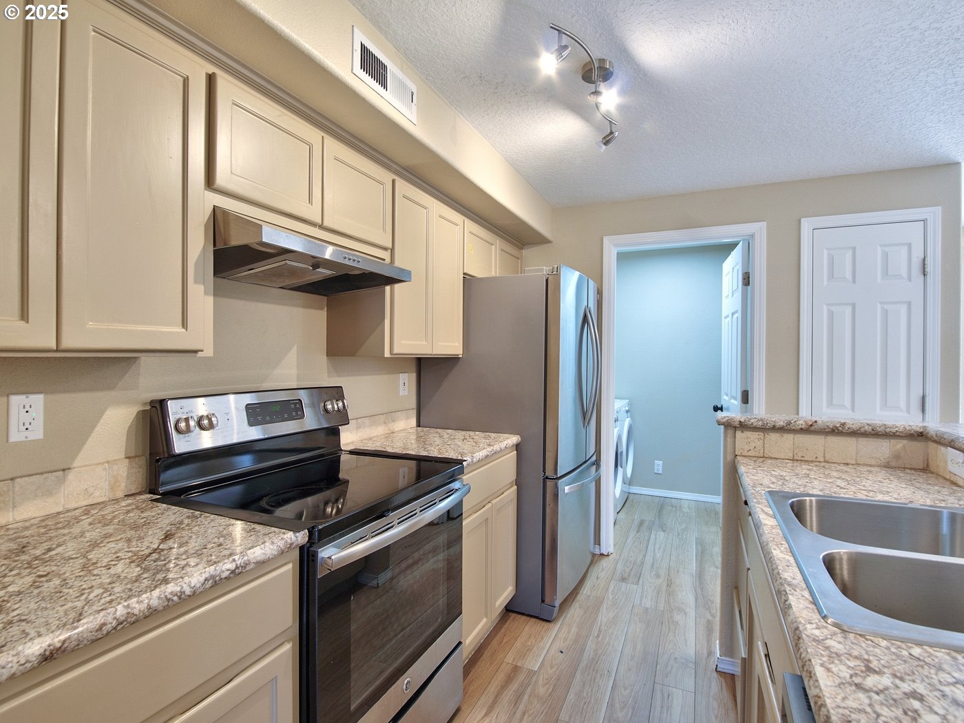 3229 North Meridian Street Newberg, OR 97132 - Photo 11 of 41 a kitchen with stainless steel appliances granite countertop a sink stove and refrigerator
