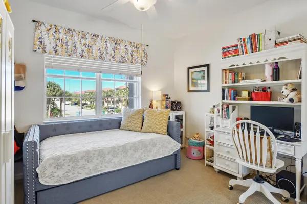 a bedroom with bed and a couch