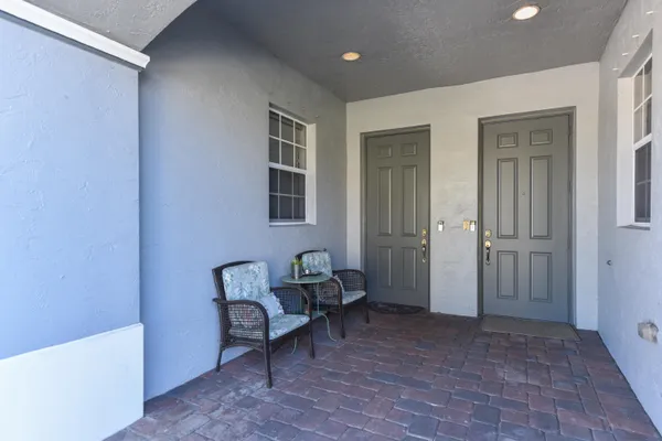 a view of a bedroom with furniture and windows