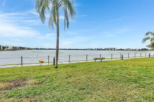 a view of a lake with houses in background