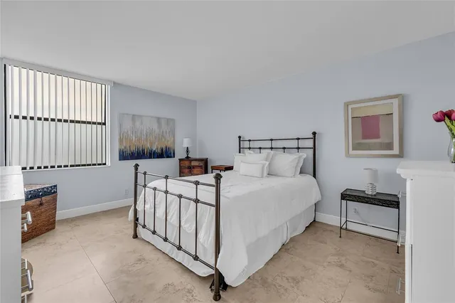 a bed room with furniture and a window