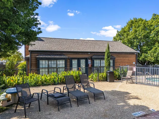a view of a house with patio outdoor seating