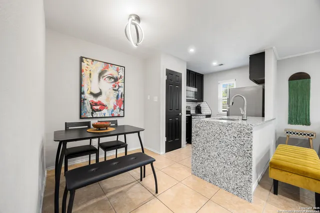 a bedroom with furniture and a wooden floor