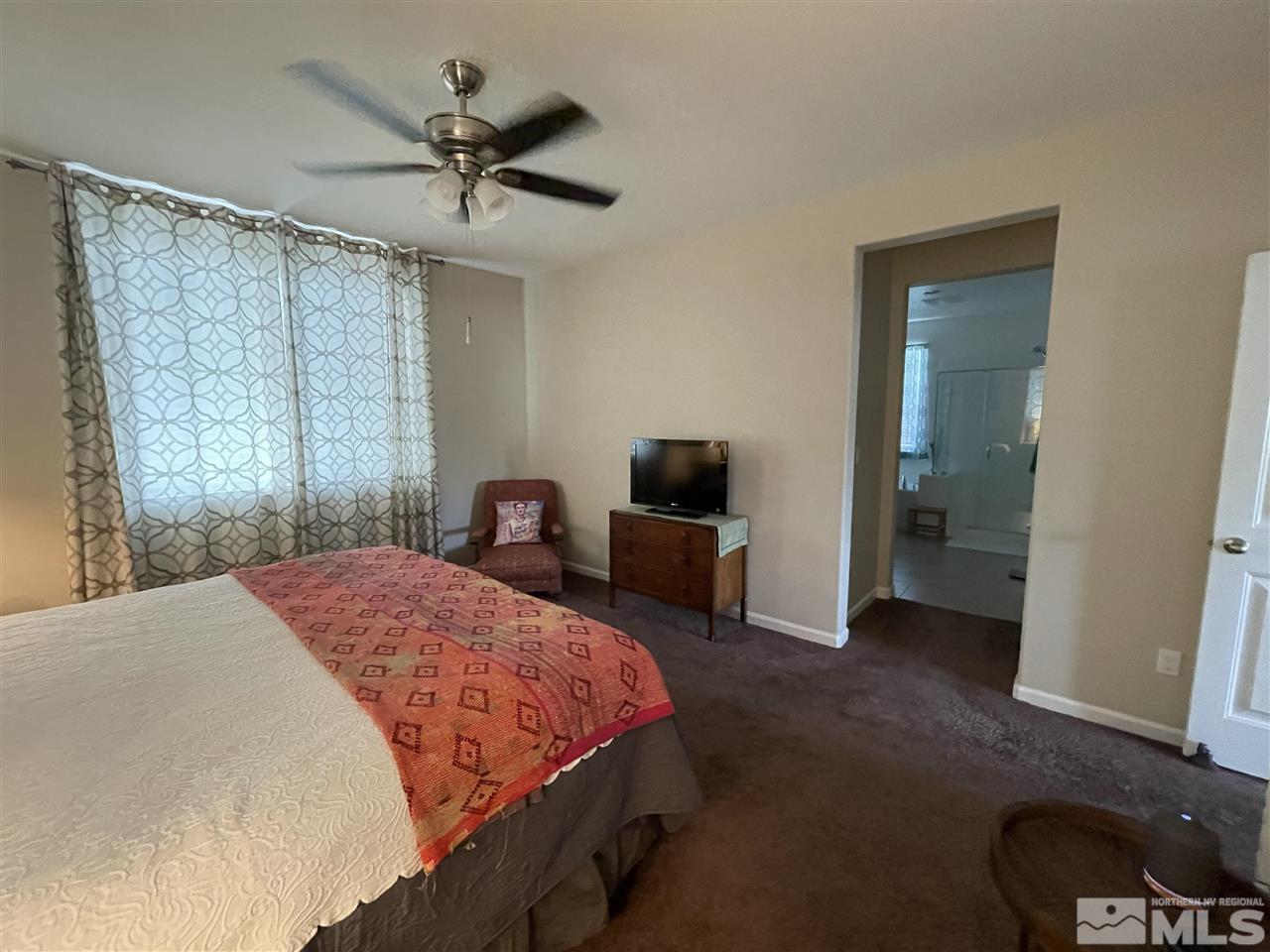 2165 Hope Valley Drive Reno, NV 89521 - Photo 15 of 22 a bedroom with a bed and a chandelier