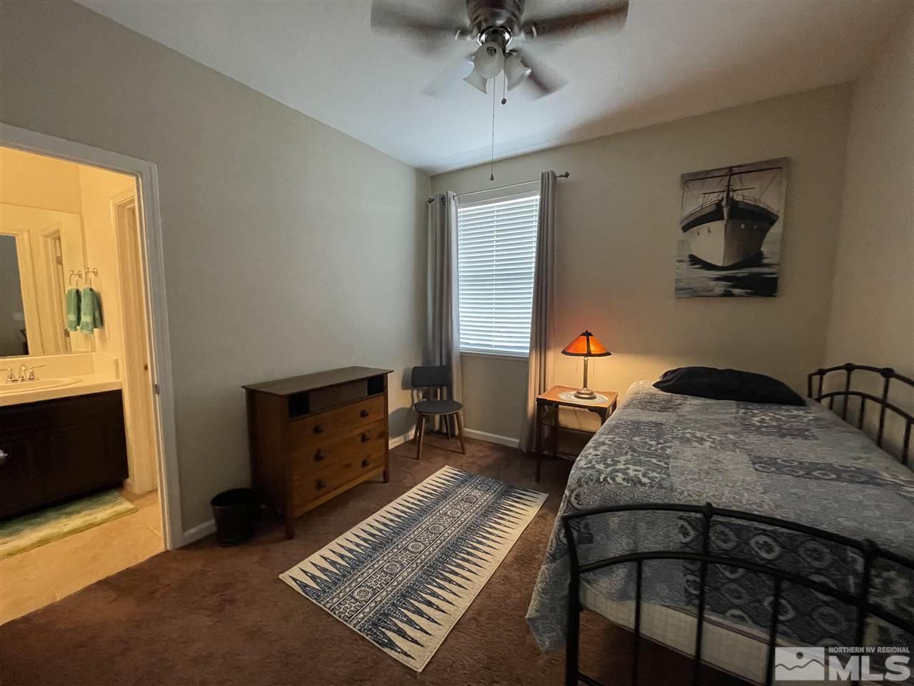 2165 Hope Valley Drive Reno, NV 89521 - Photo 17 of 22 a bedroom with a bed and wooden floor