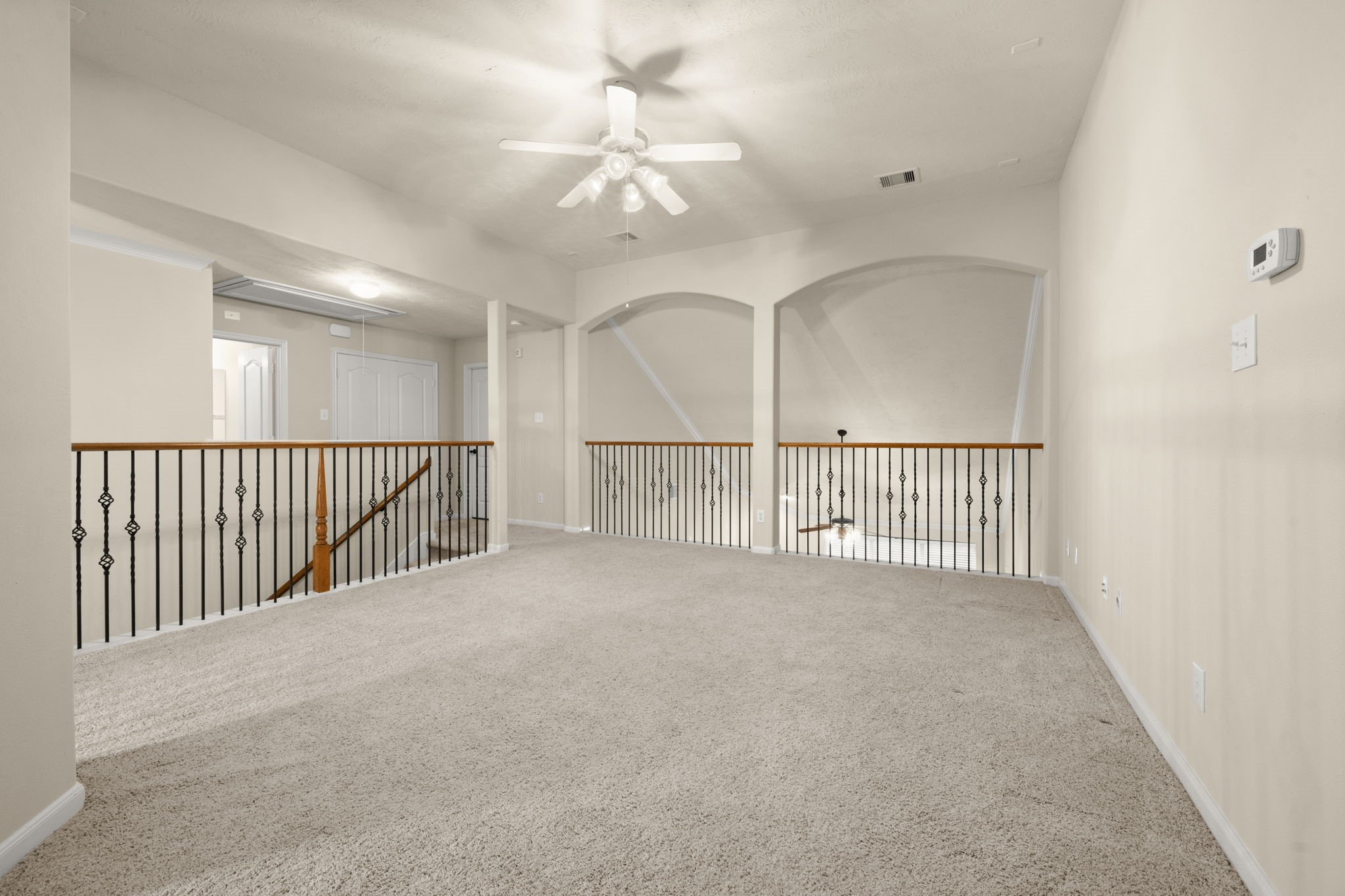 17411 Rainer Valley Lane Humble, TX 77346 - Photo 15 of 21 a view of a hallway with a chandelier